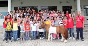 Photos 9 & 10: <br>
Accompanied by CARE@hkjc volunteers, more than 70 citizens from low income families are given the chance to enjoy riding on the Open Day, a visit co-organised by the Cluba?s community partner, the Hong Kong Women Development Association. 