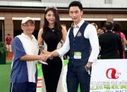 Chen Mengyuan, ATV Miss Asia Pageant 2013 Second Runner-up and Zhong Hao, ATV Mr Asia Contest 2013 winner, present a prize of HK$1,500 and a miniature to the Stables Assistant responsible for Rewarding Hero, the Best Turned Out Horse in the ATV Cup.
