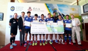Club CEO Winfried Engelbrecht-Bresges (1st right), Fifth Vice-Chairman of TWGHs cum Chairman of Community Services Committee Sunny Tan (2nd left), Manchester United legend Ronny Johnsen (4th right) and the Hong Kong Head Coach of Manchester United Soccer School Christopher Oa?Brien (1st left) present a boarding pass to the six best performers, who will go to Manchester next month to join local community programmes run by the Manchester United Football Club.