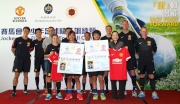 The Cluba?s Corporate Business Planning and Programme Management Director Scarlette Leung (front row, 1st right) with Hong Kong Football Association Academy Head Coach Xavi Bravo (back row, 3rd left) and MUSS coaches, present Manchester United football shirts and a?football passportsa? to the two best players, Wong Wai-yee (front row, 2nd left) and Willis Tung (front row, 2nd right).