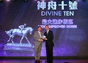 Mr Charles Chan, President of the Hong Kong Racehorse Owners Association, presents the trophy to the owner representative of Most Improved Horse Divine Ten.