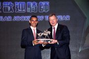 Joao Moreira, voted the Most Popular Jockey of the Year, receives the trophy from Mr Winfried Engelbrecht-Bresges, CEO of The Hong Kong Jockey Club.