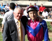 Eleven-time South African Champion Jockey-turned-trainer Michael Roberts (left) and Dicky Lui smile for the camera.