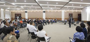 Club Chairman T. Brian Stevenson chats with students of the Sichuan UniversityaᡧHong Kong Polytechnic University Institute for Disaster Management and Reconstruction.