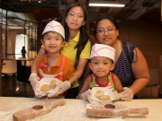 Children learn from the experienced Club chef how to make mooncakes.  They can make two mooncakes each to share with their families.