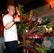 Photos 2/3/4:<br>Club Stewards Anthony W K Chow (photo 2) and Michael Lee (photo 3), and Executive Director, Charities and Community Cheung Leong (photo 4) perform the fire dragon decorating rituals. 