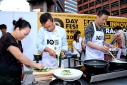 Photos 2/3:<br>The Cluba?s Executive Director, Charities and Community Leong Cheung (centre) uses surplus fresh food to prepare a spicy chicken dish with celebrity chef Jacky Yu (right) and Chan Qin-yan (left) who is from a low-income family.
