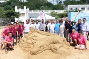 Officiating guests pictured with sand sculpting team.