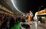 Photos 3, 4<br>
Legendary band EMS performs German drinking songs to enhance the festive mood of the opening night.