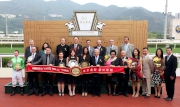Dr Simon Ip, Chairman of HKJC; Club Stewards; HKJC CEO Winfried Engelbrecht-Bresges; officiating guests from Oriental Watch Holdings Limited and the winning connections smile for the camera at the Oriental Watch Sha Tin Trophy presentation ceremony.