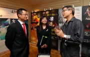 The Club's Executive Director, Charities and Community, Leong Cheung (left), Head of Charities Projects Rhoda Chan (centre) and the Jockey Club Local Creative Talents Series: Datong aᡧ The Chinese Utopia composer Chan Hing-yan (right).