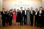 Club Chairman Dr Simon S O Ip (3rd right) joins the Cluba?s Executive Director, Charities and Community Leong Cheung (2nd right), HKSAR Chief Executive Leung Chun-ying and spouse (6th to 7th right), LEAP Chairman James Tong (1st right), LEAPa?s Life Buddy Vivienne Tam (5th left) and other guests to celebrate the 20th Anniversary of LEAP. 