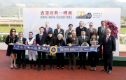 HKJC Chairman Dr Simon Ip, HKJC Stewards, Club��s CEO Winfried Engelbrecht-Bresges, and connections of Beauty Only, smile for cameras in the Hong Kong Classic Mile trophy presentation ceremony.