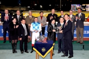 Photos 5, 6, 7:<br>
Mr Philip N L Chen, Steward of the HKJC, presents the silver dishes to PLEASURE GAINS��s Owners Mr & Mrs Michael C C Kao, Trainer Manfred Man and Jockey Douglas Whyte.
