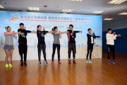 Hong Kong Elite Athletes (Marathon) Chow Chi-ngan demonstrates warm up exercises to other guests.
