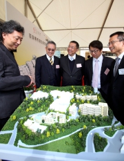 Architect Eric Chan (1st left) explains the design of Hong Chi Jockey Club Pinehill Village to Club Deputy Chairman Anthony W K Chow (2nd left), Executive Director, Charities and Community Leong Cheung (1st right), Under Secretary for Labour and Welfare Stephen Sui (2nd right) and Hong Chi Association Chairman Philip Poon (centre). 