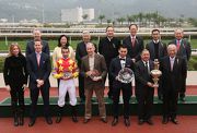 HKJC Stewards, Chief Executive Officer Winfried Engelbrecht-Bresges and winning connections of Designs On Rome take a group photo at the presentation ceremony of the Centenary Vase.