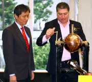 William A Nader, Executive Director, Racing of the Hong Kong Jockey Club (right), and Kwang Eng Seong, Acting Director of Racing of the Macau Jockey Club (left), jointly draw the horse at the Hong Kong Macau Trophy 2015 barrier draw ceremony at Sha Tin racecourse this morning.