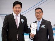 Newman Tsang, Managing Director - Hong Kong & Macau, BMW Concessionaires (HK) Ltd & Sime Darby Motor Group (HK) Limited; and Michael Lee, Steward of The Hong Kong Jockey Club, jointly draw the first horse, Dynamism, at the ceremony.