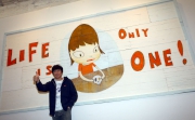Japanese artist Yoshitomo Nara with his artwork Life is Only One.