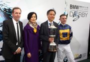 Happy connections pose for cameras with the BMW Hong Kong Derby trophy.