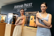 Models demonstrate the Audemars Piguet timepieces.