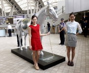 A dazzling horse statue is on display for photo opportunities.
