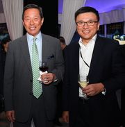 Club Chairman Dr Simon S O Ip (left) and Secretary for Financial Services and the Treasury K C Chan (right) at HKJCa?s Gala Evening.