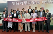 Mr Ted Akiskalos, Marketing Director �V Hong Kong, Macau, Taiwan of Carlsberg Hong Kong Limited, smiles for camera with connections of Fantastic Kaka and HKJC��s Stewards at the trophy presentation ceremony of the SKOL Cup.