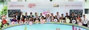 Under Secretary for Home Affairs Florence Hui (9th left, front row), Club Chairman Dr Simon Ip (7th right, front row) and Club CEO Winfried Engelbrecht-Bresges (8th left, front row) join representatives from the Cluba?s district partners under the Hong Kong Jockey Club Community Partners Network and its beneficiary organisations to pose for a group photo.