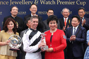 Mrs Vinny Chu, Executive Director of Prince Jewellery & Watch, present a souvenir to winning jockey Nash Rawiller.