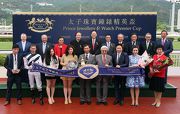Stewards and CEO of the Club and senior management of the Prince Jewellery & Watch pose for the cameras with connections of Secret Sham at the trophy presentation ceremony for the Prince Jewellery & Watch Premier Cup.