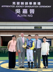 Alvin Ng and his family gather for a group photo with William A Nader (2nd from left), HKJC Executive Director of Racing, and Amy Chan Lim-chee (1st from left), HKJC Manager, Racing Development Board/Headmistress of the Apprentice Jockeys�� School at the graduation ceremony.