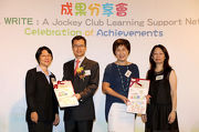 The Cluba?s Executive Director, Charities and Community, Leong Cheung (2nd left) and The Education Bureau Deputy Secretary (Professional Development Special Education Branch) Mrs Wong Yau Wai-ching (2nd right) receive souvenirs from READ & WRITE Principal Investigator Professor Connie Ho (1st right) and Professor Cheng Pui-wan (1st left). 