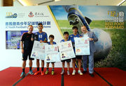 Photos 4, 5<br>Club CEO Winfried Engelbrecht-Bresges (1st right) and the Hong Kong Head Coach of Manchester United Soccer School Christopher Oa?Brien (1st left) present passports to the four winners of the HKJC Community Festival Skill Challenge (photo 4) and two outstanding school coaches from the JC School Football Development Scheme (photo 5), who will also be going to England for training and exchange.