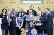 Photo 5, 6, 7<br>
Mr Philip N L Chen (front row, first from right), Steward of the Hong Kong Jockey Club, presents the Oriental Watch Sha Tin Trophy and silver dish each to Benson Lo Tak Wing, owner of Contentment, trainer John Size and jockey Joao Moreira.