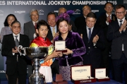 Ms Karen Au Yeung, Vice President of LONGINES Hong Kong, presents a medal to Keita Tosaki, second runner-up of the LONGINES International Jockeys' Championship.