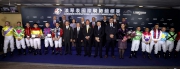 The guests, Stewards and CEO of the HKJC and jockeys take a group photo at the LONGINES International Jockeys' Championship presentation ceremony.