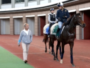 Andre Fabre talks to work rider Annelie Ackerman this morning as Flintshire leads Esoterique around the Sha Tin Parade Ring.