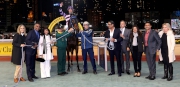 Happy connections of Domineer celebrate their runner��s victory in the winners�� circle.