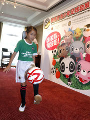 Young footballer demonstrating her skills at the press conference.