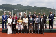 Dr Simon Ip, Chairman of The Hong Kong Jockey Club; Stewards of the Club; Winfried Engelbrecht-Bresges, Chief Executive Officer of the Hong Kong Jockey Club and connections of race winner Peniaphobia, smile for the cameras at the Sha Tin Vase presentation ceremony.
