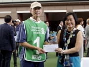 Before the race, May Tan, Chief Executive Officer, Standard Chartered Bank (Hong Kong) Limited, presents a HK$5,000 prize and a souvenir to the Stables Assistant responsible for Werther, the best turned out horse for the Standard Chartered Champions & Chater Cup.