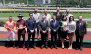 HKJC Stewards and connections of Premier Plate winner Helene Paragon, smile for cameras at the presentation ceremony.