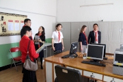 The Cluba?s Executive Manager, Sustainability, Shirlee Algire (second from right) and General Manager of Shenzhen HKJC Technology Development Limited Boyd Gu (first from right) tour the school to see the newly installed computers donated by the Club. 