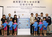 The Club's Head of Charities Projects Rhoda Chan (back row, 3rd left) was joined at todaya?s press conference by Assistant Director of Leisure Services Richard Wong (back row, 4th right); President of the Hong Kong Amateur Swimming Association Ronnie Wong (back row, 3rd right); Deputy Chief Executive of Ocean Park Matthias Li (back row, 2nd left); and Assistant Professor of Sport Psychology at the University of Hong Kong, Derwin Chan (back row, 2nd right).