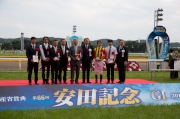 Connections of Logotype celebrate at the Yasuda Kinen trophy presentation ceremony.