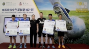 The Cluba?s Executive Director, Corporate Planning, Communications and Membership Scarlette Leung (3rd left) and the Hong Kong Head Coach of Manchester United Soccer School Christopher Oa?Brien (3rd right) present a?passportsa? to the four winners of the HKJC Soccer 4 contest who will also be going to England for training and exchange.