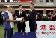 Mr Huang Zhuoqin (right), 2010 Asian Games Silver Medallist in Team Dressage from Guangdong and Mr Shek Wai-hung (middle), 2014 Asian Games Gold Medallist in Gymnastics from Hong Kong present the Best Turned Out Horse award and $1,500 prize to the Stables Assistant  responsible.