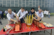 Anthony Kelly, Executive Director, Racing Business and Operations (second from right), trainer Michael Chang (second from left) and Club executives attend a bai-sun ceremony for the new equine swimming pool at the Olympic Stables of Sha Tin racecourse this morning.